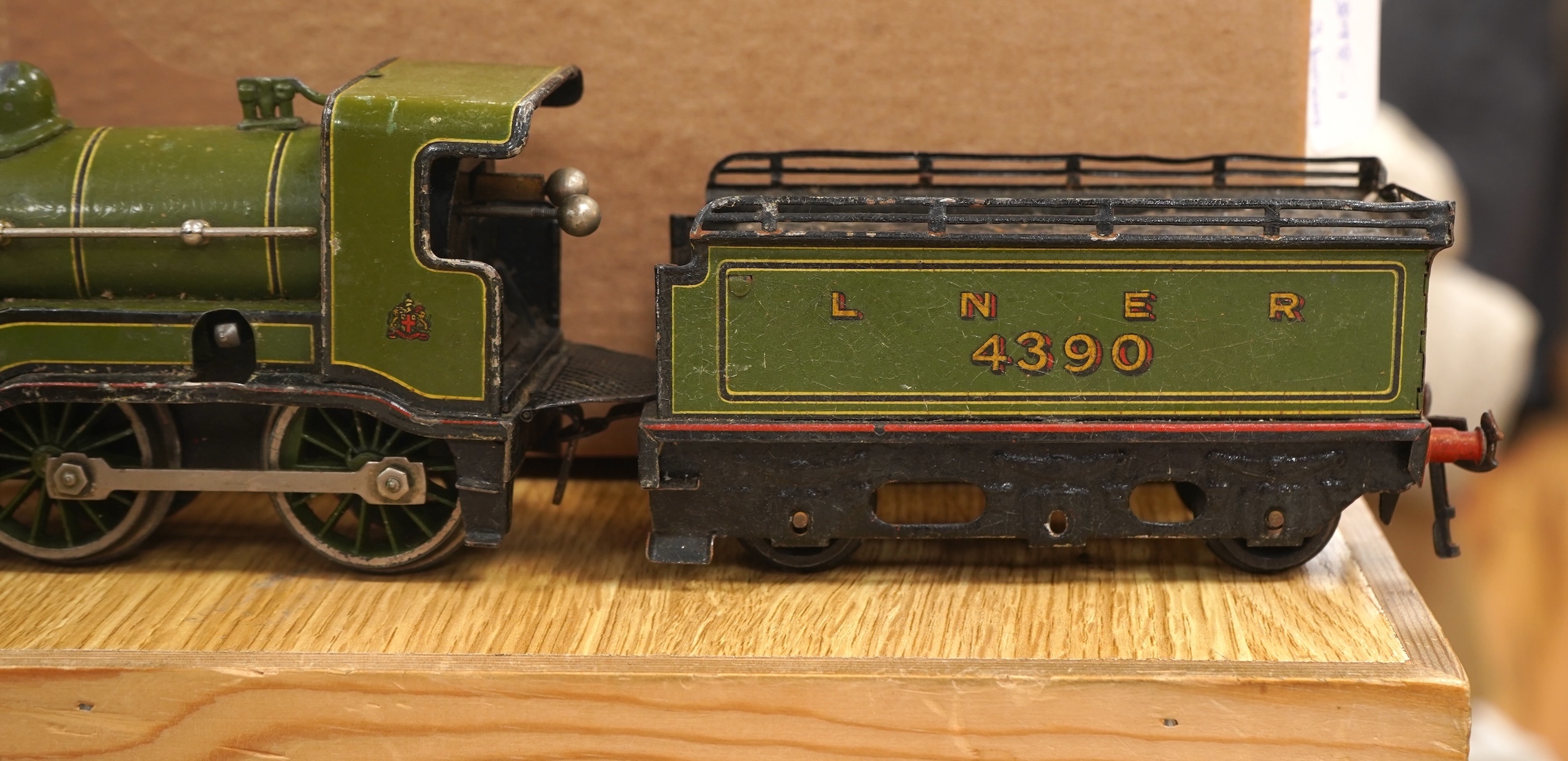A Bing for Bassett Lowke 0 gauge tinplate clockwork LNER Ivatt 4-4-0 tender locomotive, 4390, together with an early Hornby clockwork 0-4-0, 2710, in GNR green livery with Meccano Ltd roundels to locomotive splasher and